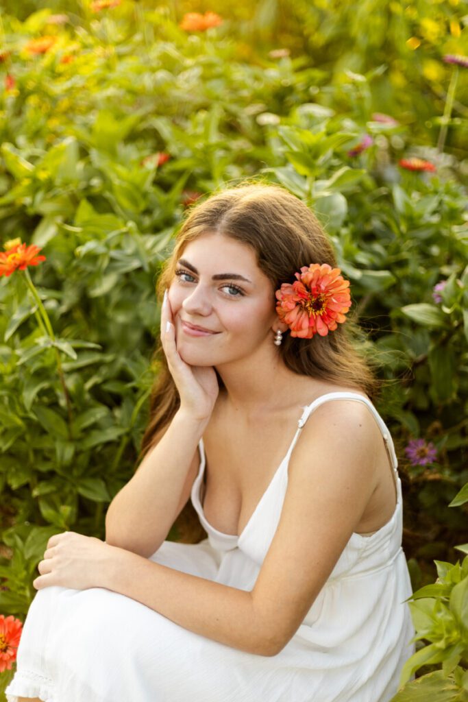 Senior girl in golden flower field at sunset in Berks County, PA